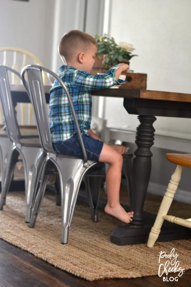 Farmhouse dining room - DIY farmhouse table paired with industrial metal chairs and a bench.
