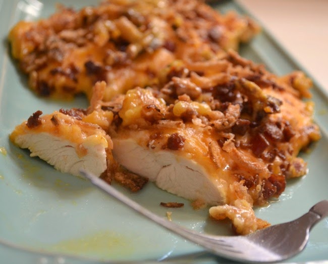 Smothered and Covered Chicken Breasts -- A quick dinner. Chicken breasts smothered and covered in honey mustard, cheese, bacon and french fried onions.