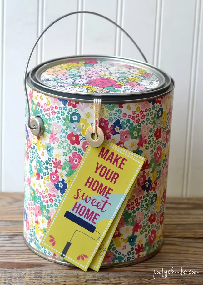 Need a fun housewarming gift idea? Stuff a paint can with paint supplies and tie on this free printable tag.