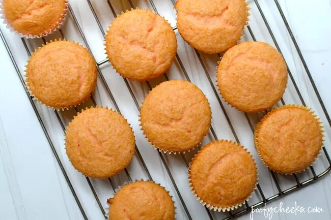 Create spooky Halloween cupcakes with a boxed cake mix and Fanta. Oreo Witch Hats add to the spookiness of these fun cupcakes!