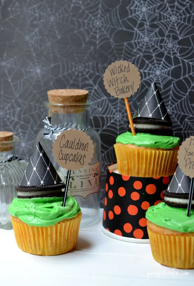Create spooky Halloween cupcakes with a boxed cake mix and Fanta. Oreo Witch Hats add to the spookiness of these fun cupcakes!