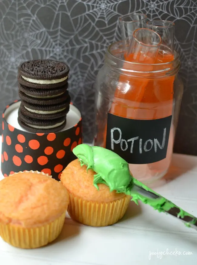 Create spooky Halloween cupcakes with a boxed cake mix and Fanta. Oreo Witch Hats add to the spookiness of these fun cupcakes!