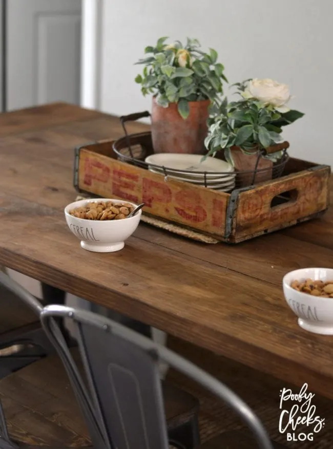 Farmhouse dining room - DIY farmhouse table paired with industrial metal chairs and a bench.