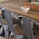 Farmhouse dining room - DIY farmhouse table paired with industrial metal chairs and a bench.