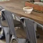 Farmhouse dining room - DIY farmhouse table paired with industrial metal chairs and a bench.