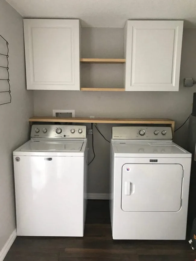 Laundry Room Storage Solutions - Add cabinets and shelving above washer and dryer for storage and organization.