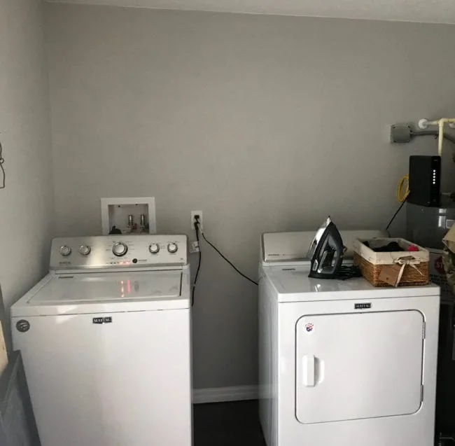 Laundry Room Storage Solutions - Add cabinets and shelving above washer and dryer for storage and organization.