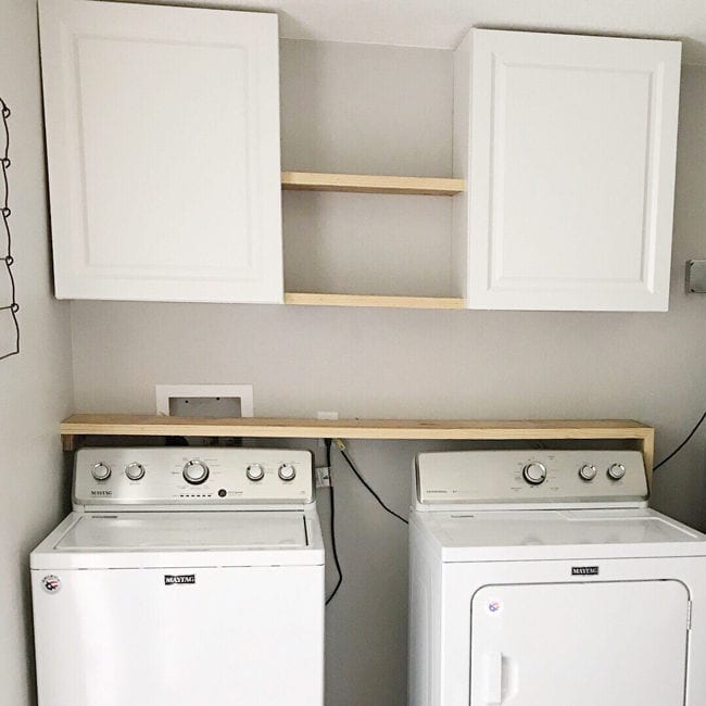 Laundry Room Storage Solutions - Add cabinets and shelving above washer and dryer for storage and organization.