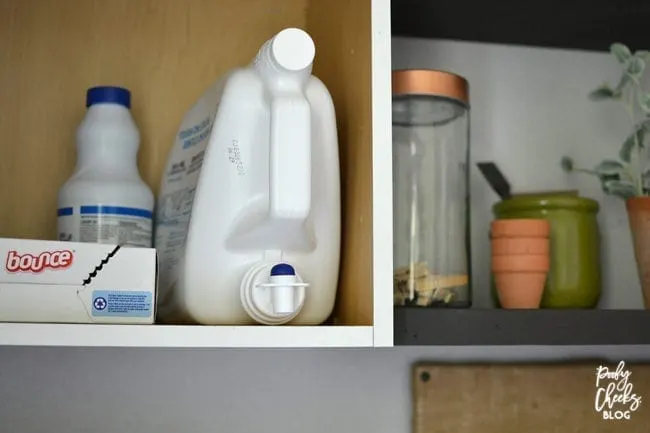 Laundry room before and after - an ugly boring laundry room transformed into a farmhouse laundry room.